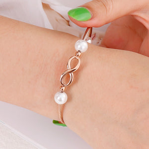 Simple and Fashion Plated Rose Gold Infinity Symbol 316L Stainless Steel Bangle with Imitation Pearls