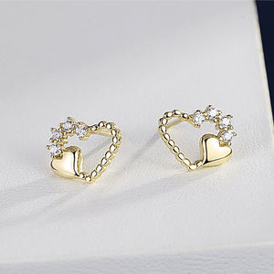 925 Sterling Silver Plated Gold Simple and Fashion Hollow Heart-shaped Stud Earrings with Cubic Zirconia