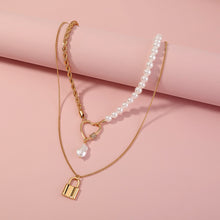 Load image into Gallery viewer, Fashion Simple Plated Gold Hollow Heart Lock Pendant with Imitation Pearl Beaded Double Layer Necklace