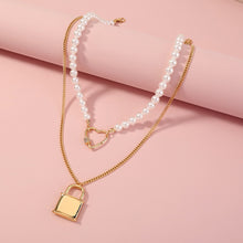 Load image into Gallery viewer, Fashion and Elegant Plated Gold Lock Hollow Heart Cubic Zirconia Pendant with Imitation Pearl Beaded Double Necklace